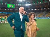 Belo e Alcione viram meme ao cantarem hino nacional em amistoso da seleção brasileira - Foto: Reprodução/TV Globo